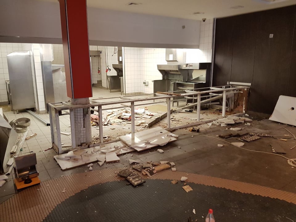 Loose building material and debris awaiting removal from a room
