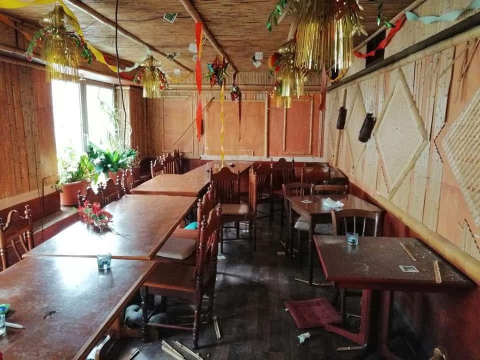 Furnished interior with tables and chairs before a property clearance
