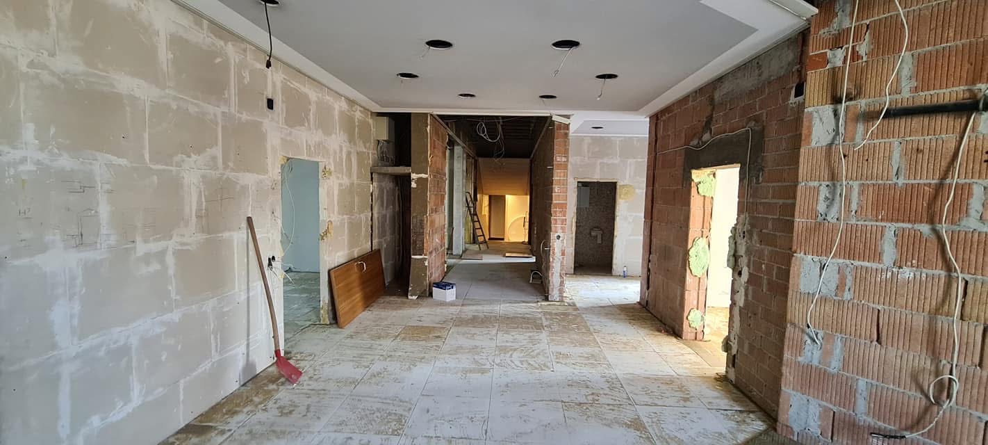 Empty interior corridor with exposed walls following clearance